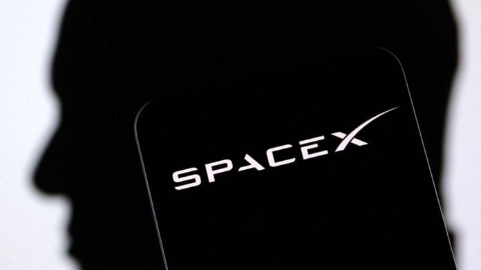 SpaceX logo and Elon Musk silhouette are seen in this illustration | Reuters
