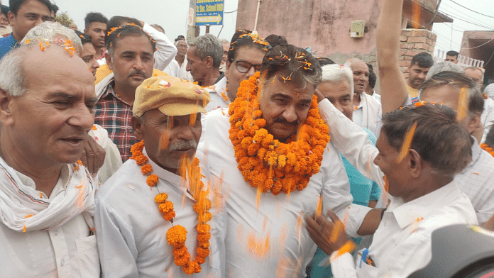 File photo of Jind MLA Krishan Lal Middha being felicitated after an event in his constituency | Credit: @DrKrishanLalMi4