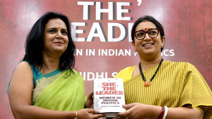 Smriti Irani with author Nidhi Sharma at the launch of her book She, The Leader. | ANI