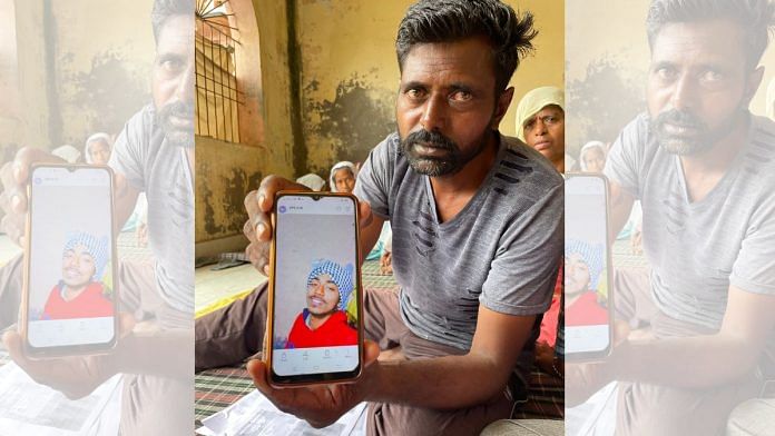Ravinder Kumar shows a picture of his son Tony. Tony was one of the many men trafficked to Libya for construction work. | Sagrika Kissu | ThePrint
