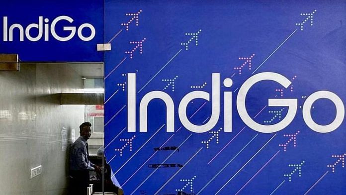 A person is seen inside an IndiGo airlines ticketing office at Chhatrapati Shivaji International airport in Mumbai | Reuters file photo