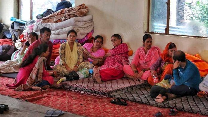 Krishna Nagar residents who were evacuated after the 15 August landslide, at Ambedkar Bhawan in Shimla | Praveen Jain | ThePrint