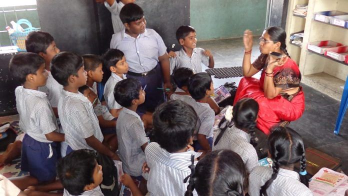 A primary school teacher shows her class a cell phone in Chennai | Representational image via Flickr