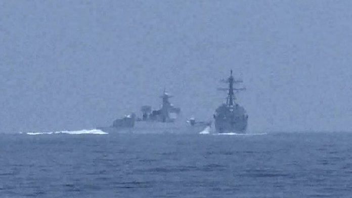 File photo of China's warship crossing the path of US Navy destroyer USS Chung-Hoon as it was transiting the Taiwan Strait with the Royal Canadian Navy frigate HMCS Montreal, in a still image from video | Global News via Reuters