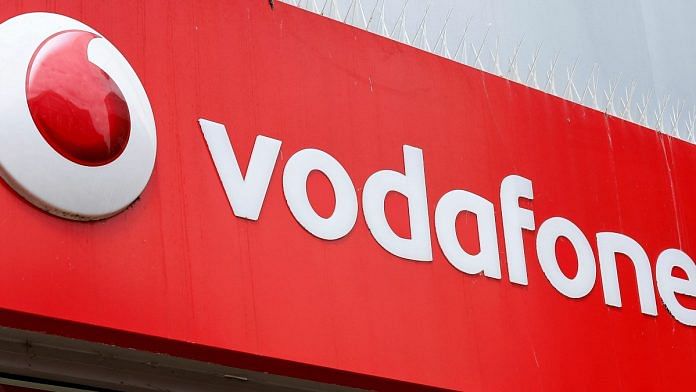 The logo of Vodafone is seen at a Vodafone store in Northwich, Cheshire, Britain | Reuters