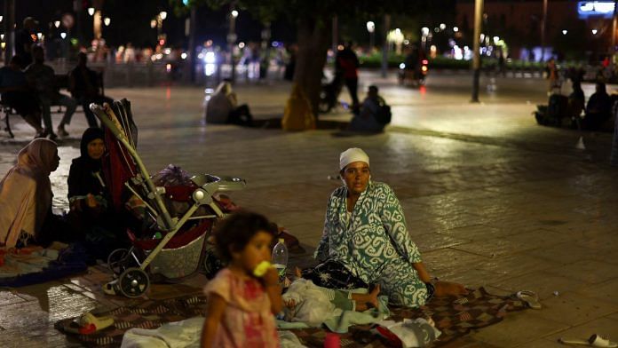 Residents rest in central Marrakesh following a powerful earthquake in Morocco | Reuters