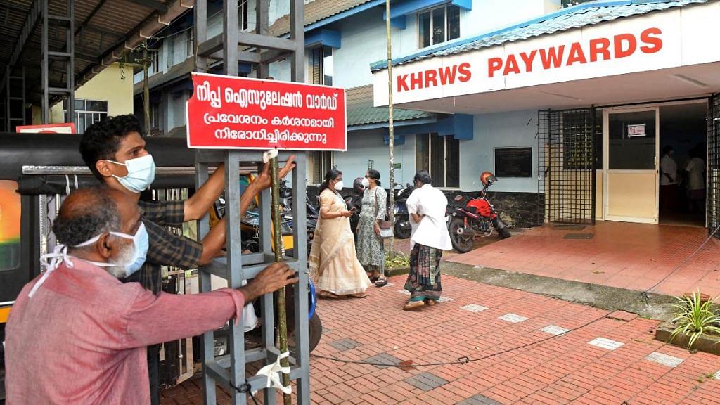 Staff members install a sign reading "Nipah isolation ward, entry strictly prohibited" at a hospital where a ward is being prepared for suspected Nipah virus patients in Kozhikode district, Kerala, India | Reuters