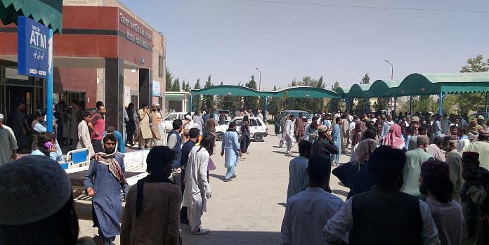 People gather outside the Mastung hospital, following a deadly suicide attack on a religious gathering in Balochistan province, Pakistan, September 29, 2023 in this handout image. Shaheed Nawab Ghous Bakhsh Raisani Memorial Hospital Mastung/Handout via REUTERS