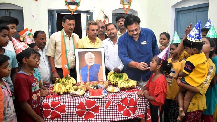 BJP supporters celebrate Prime Minister Narendra Modi's 73rd birthday at orphanage on its eve, in Prayagraj on Saturday | ANI