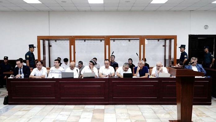 Defendants and lawyers attend a court hearing in the case of child deaths linked to contaminated cough syrups, in Tashkent, Uzbekistan August 16, 2023 | Reuters