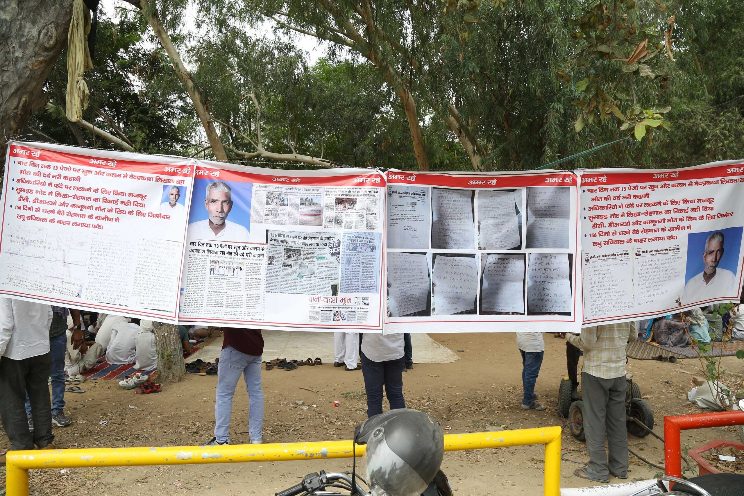 Banners at the dharna site show Ved Prakash's photo and his purported suicide note | Suraj Singh Bisht | ThePrint