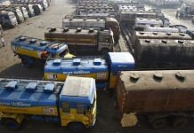 Oil tankers are seen parked at a yard outside a fuel depot on the outskirts of Kolkata February 3, 2015/Reuters