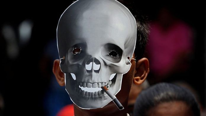 A child wearing a skull mask attends an anti-tobacco awareness rally during the World No Tobacco Day in Kolkata, India, May 31, 2019 | Reuters
