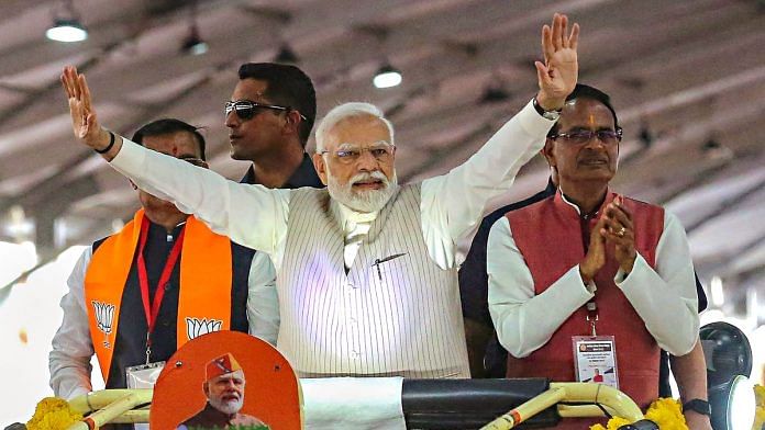 PM Narendra Modi waves at supporters as he arrives to address the 'Karyakarta Mahakumbh', in Bhopal, on 25 September 2023 | PTI