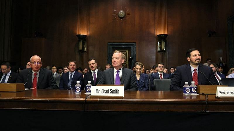 Microsoft President Brad Smith, Nvidia's chief scientist William Dally, and Professor Woodrow Hartzog wait to testify before a Senate Judiciary Privacy, Technology, and the Law Subcommittee hearing on "Oversight of A.I.: Legislating on Artificial Intelligence" on Capitol Hill in Washington, U.S., September 12, 2023 | Reuters