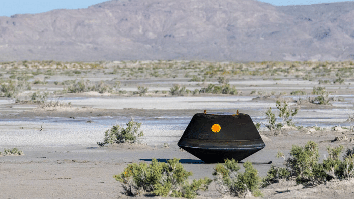 The sample return capsule from NASA’s OSIRIS-REx mission seen shortly after touching down in the desert, Sunday | Photo courtesy: NASA/Keegan Barber | nasa.gov