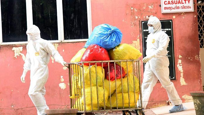 Hospital staff removes the waste from an isolation ward of Ernakulam Medical College after a rise in the number of Nipah cases in Kochi | ANI