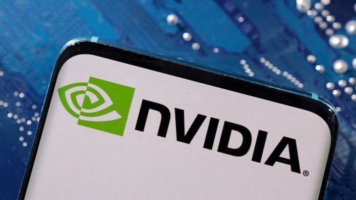 A smartphone with a displayed NVIDIA logo is placed on a computer motherboard in this illustration | Reuters