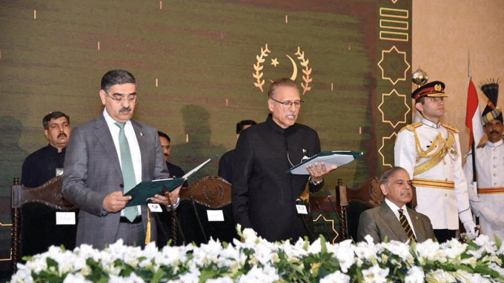 Pakistan's caretaker Prime Minister Anwaar-ul-Haq Kakar (L) taking oath from Pakistan's President Arif Alvi, in Islamabad | Reuters file