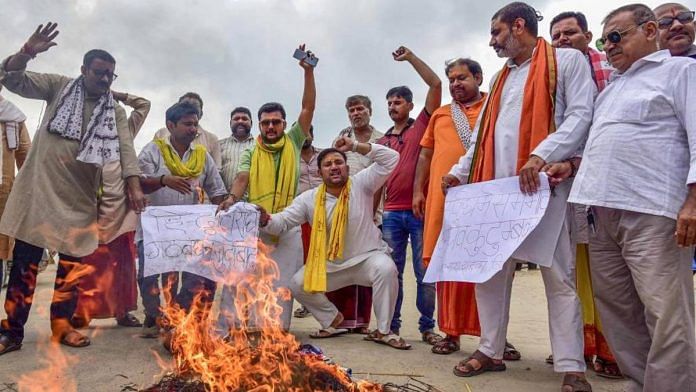 People burn an effigy during a protest against DMK leader Udhayanidhi Stalin for his comments against Sanatana Dharma in Prayagraj Tuesday | Photo: PTI