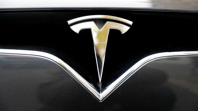 The company logo is pictured on a Tesla Model X electric car in Berlin | Reuters