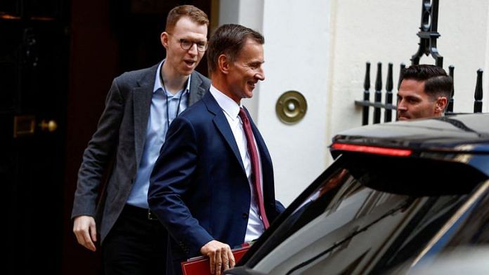 British Chancellor of the Exchequer Jeremy Hunt leaves Downing Street for the Houses of Parliament, in London | Reuters