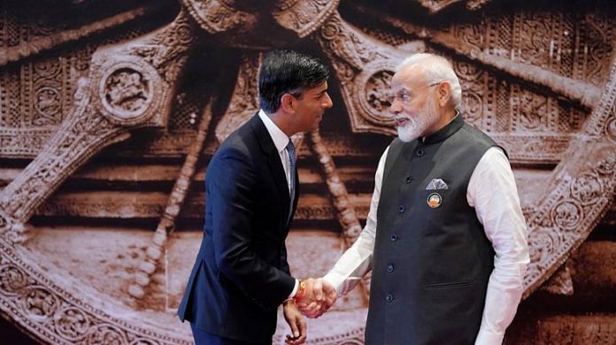 PM Narendra Modi shakes hand with British PM Rishi Sunak upon his arrival at Bharat Mandapam convention center for the G20 Summit, in New Delhi, on 9 September 2023 | Evan Vucci/Pool via Reuters