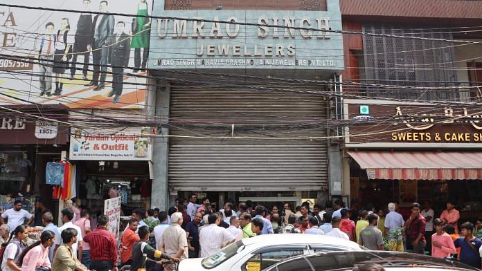 Crowd outside Umrao Singh Jewellers shop after jewellery was stolen from the shop in the Bhogal area of New Delhi, on 26 September 2023 | Suraj Singh Bisht | ThePrint