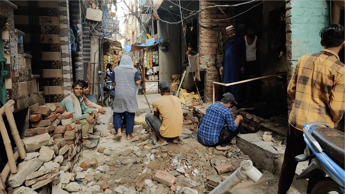 Labourers at work in the narrow lane of Block C, Jahangirpuri | Heena Fatima | ThePrint