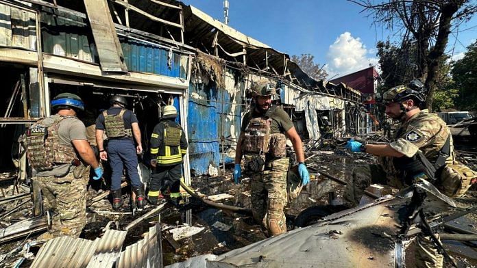 Police officers and rescuers inspect the site of a Russian military strike, amid Russia's attack on Ukraine, in Kostiantynivka. Press service of the Interior Ministry of Ukraine/Handout via Reuters
