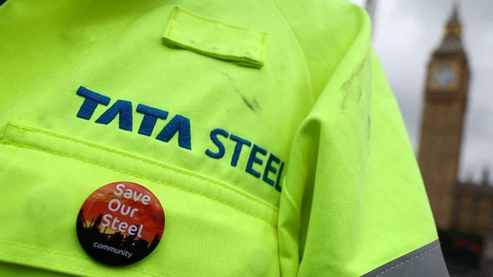 A British steel industry worker displays a badge on his Tata Steel work clothing during a protest over jobs, pay and conditions of work, outside of the Houses of Parliament in London | Reuters/Toby Melville/File photo