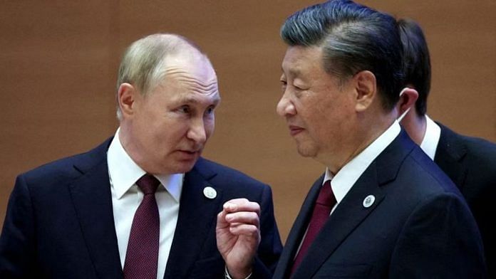 Russian President Vladimir Putin speaks with Chinese President Xi Jinping | File Photo: Reuters