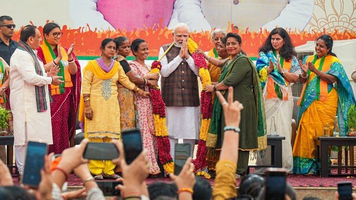 PM Narendra Modi being felicitated during the 'Nari Shakti Vandan-Abhinandan Karyakram', a day after Parliament passed the women's reservation bill, at the BJP headquarters in New Delhi | PTI photo