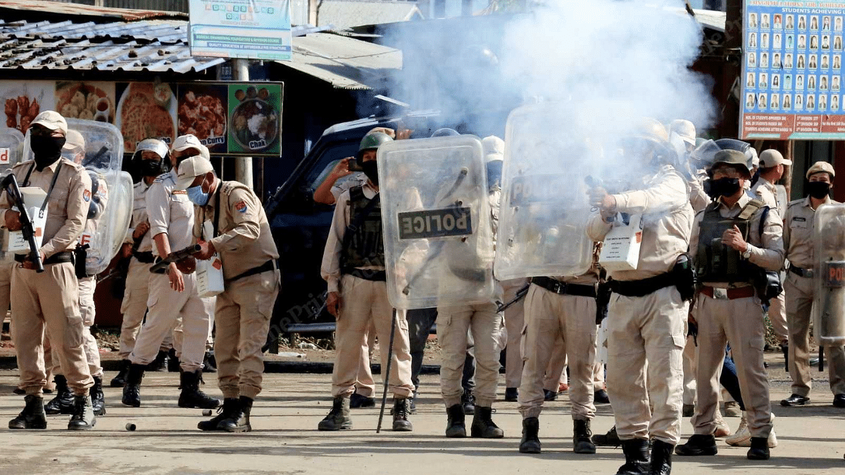Security personnel fire tear gas shells at protesters outside Porampat police station in Imphal East district | Praveen Jain | ThePrint
