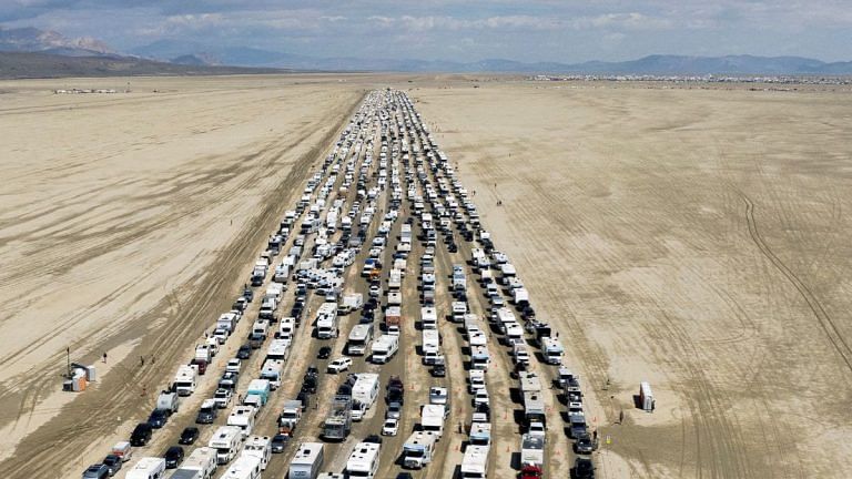 After days of mud, Burning Man festival road reopens, allowing attendees to leave