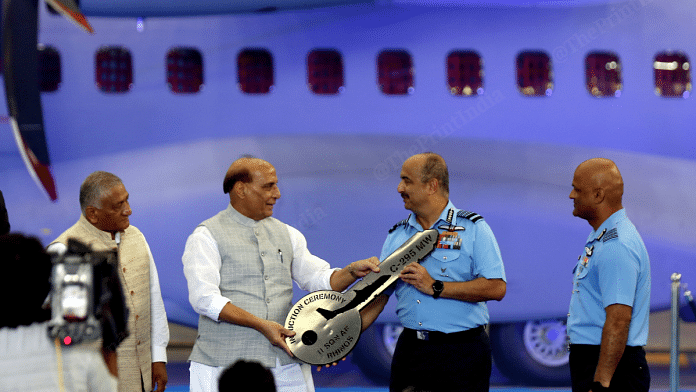 Defence Minister Rajnath Singh hands over a symbolic key to IAF chief Air Chief Marshal V. R. Chaudhari at formal induction of C295 MW transport aircraft | Suraj Singh Bisht | ThePrint