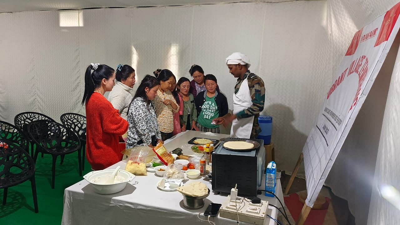 Members of Yehmotsor Gyeling SHG undergoing baking workshop at Zemithang | Karishma Hasnat, ThePrint