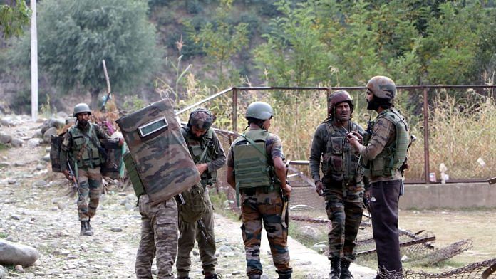 Army personnel stand guard at the site where an encounter took place between security forces and militants, in the Kokernag area of Anantnag on Wednesday | ANI