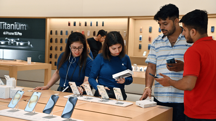 Customers check out the newly launched iPhone 15 at the Apple Inc. store during the first day of sale in New Delhi | ANI