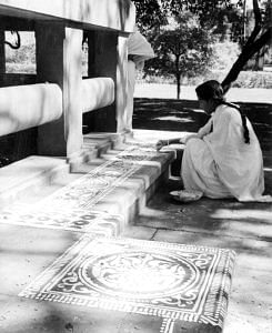 Shantiniketan: The Centre of Indian Culture,Painting with White Colour on the Floor Called Alpana, E.A.Miny, Shnatiniketan, India, c.1954, Photograph | Image courtesy of Flickr.