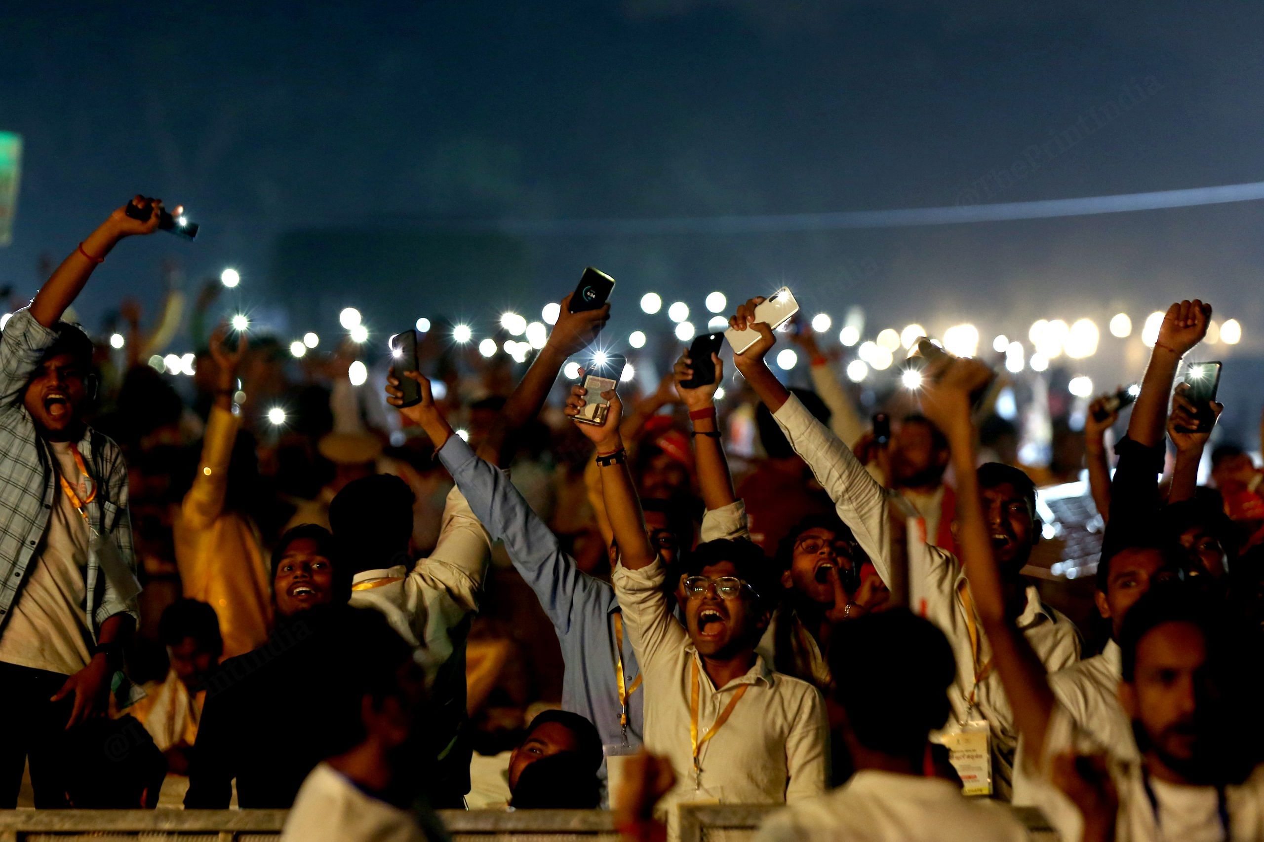 The crowd wave cellphone flashlights during the PM's speech | Photo: Suraj Singh Bisht | ThePrint