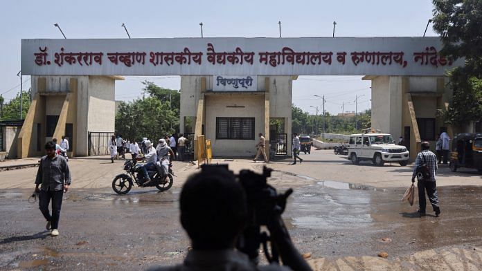 A media member takes a video outside the main gate of the Shankarrao Chavan Government Medical College and Hospital in Nanded, India | Reuters