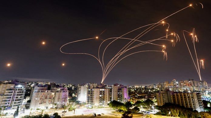 Israel-Hamas war: Israel's Iron Dome anti-missile system intercepts rockets launched from Gaza Strip, as seen from Israeli city of Ashkelon, on 9 October, 2023 | Reuters/Amir Cohen