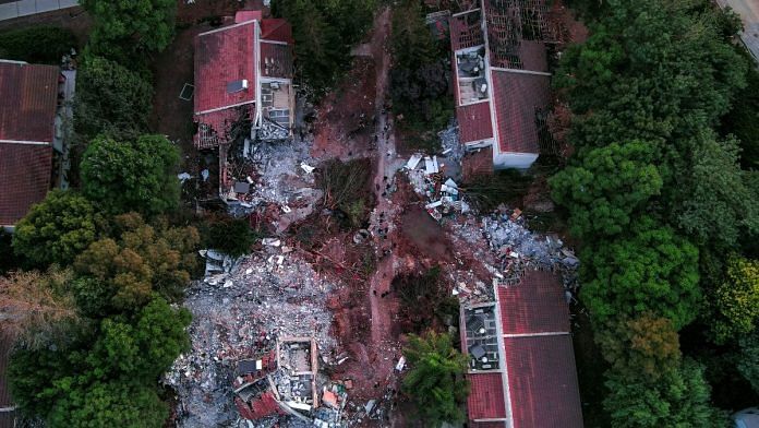 An aerial view shows damage caused following a mass infiltration by Hamas gunmen in Kibbutz Beeri in southern Israel, 11 October, 2023. REUTERS/ Ilan Rosenberg