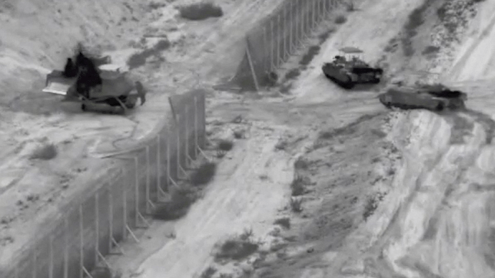 Israeli armoured vehicles take part in an operation at a location given as northern Gaza Strip in this still image taken from handout video released Thursday | Reuters