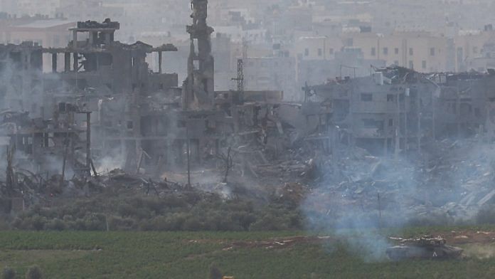 An Israeli tank manoeuvres inside Gaza Strip, as seen from Israel, on 29 October, 2023 | Reuters/Evelyn Hockstein