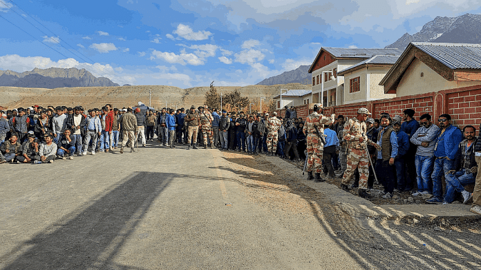 Paramilitary personnel stand guard as NC and Congress supporters wait outside amid the counting of votes for the fifth Ladakh Autonomous Hill Development Council (LAHDC)-Kargil election, in Kargil, Sunday | ANI