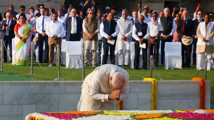 Prime Minister Narendra Modi bowing before the memorial at Rajghat, Monday | Praveen Jain | ThePrint