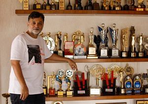 Srijit Mukherji poses with his accolades | Photo: Deep Halder | ThePrint