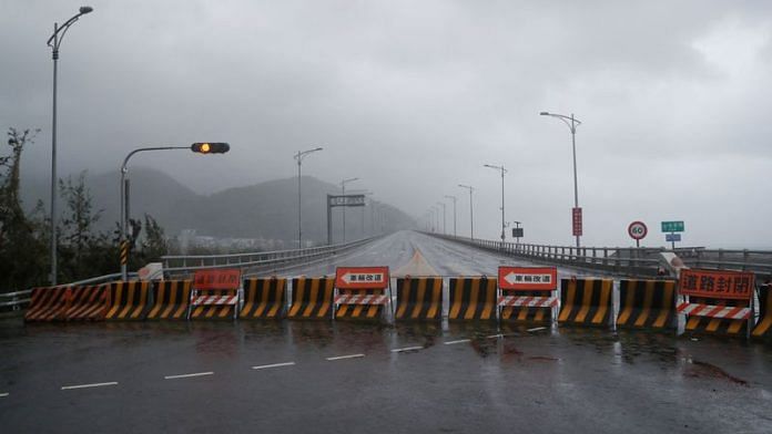 Concrete barriers placed to block the traffic on a bridge are pictured after Typhoon Koinu passed the southern tip of Taiwan, in Jinlun, Taiwan October 5, 2023. REUTERS/Carlos Garcia Rawlins